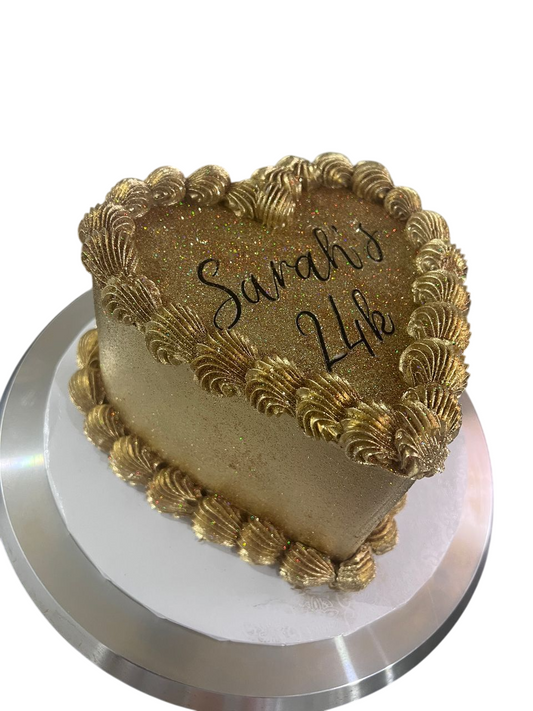 Glamorous Gold Glitter Heart-Shaped Cake With Gold Shell Piping